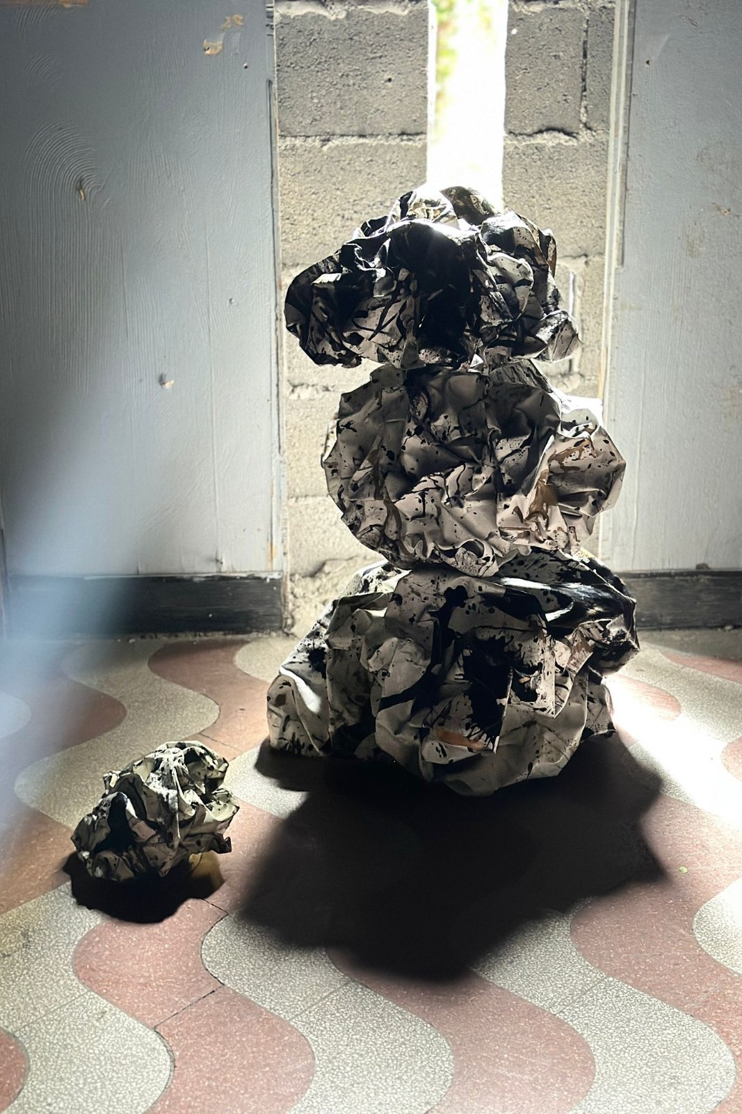Floating Water Stones in a doorway, on a patterned floor
