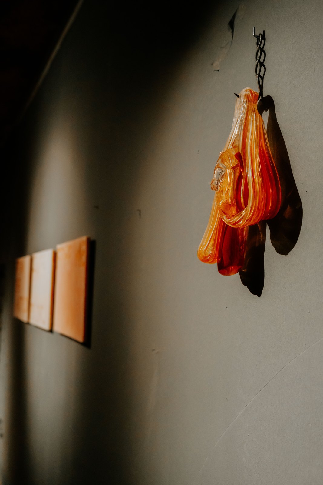 Yes, But… 2026, an orange form hanging on a chain